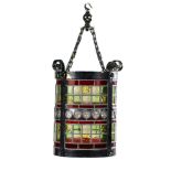 Lighting: A cylindrical painted bronze hanging lantern, late 19th century, with stained glass