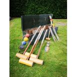 Garden games: A Jacques and Sons croquet set, early 20th century, with mallet, balls, iron hoops