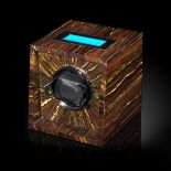 Decorative/Interior Design: A Movado watch winder veneered in tiger iron, 15cm high