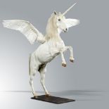 Taxidermy: An impressive mounted Pegasus, modern, made-up of pony skin and swan wings on iron