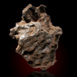A Sikhote Alin iron meteorite, 21cm by 16cm, 7.9kg