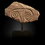 Antiquities: A carved petroglyph, Morocco^ Neolithic, on bronze stand, 23cm high overall