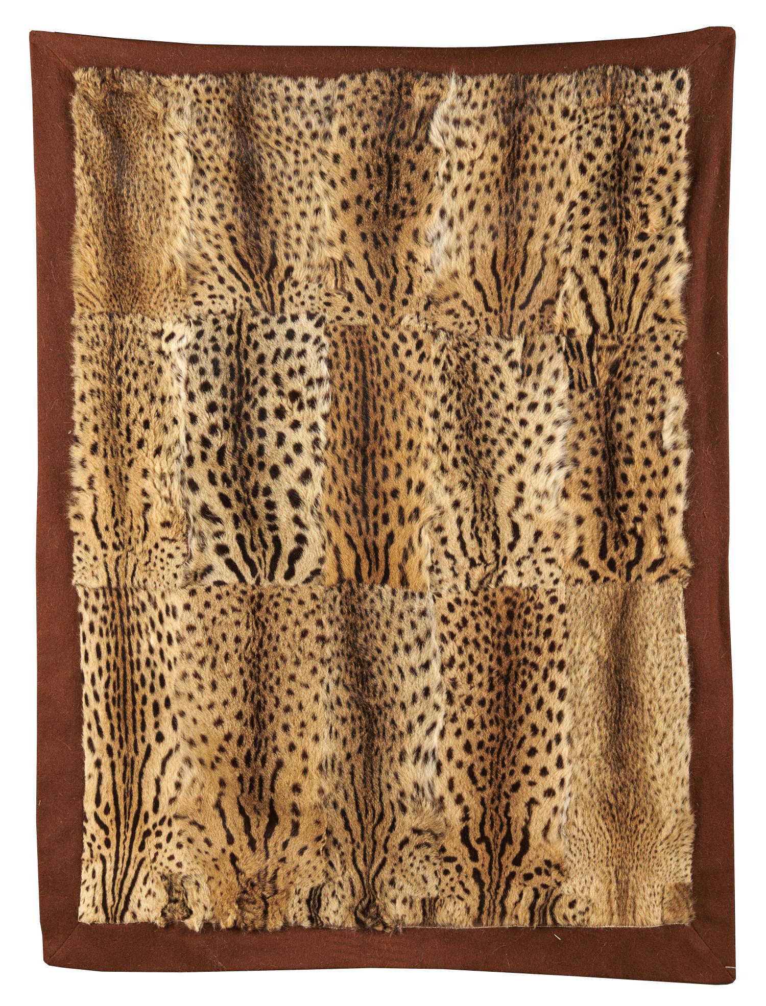 Taxidermy: A 15 skin Ocelot felt backed car rug, 1920’s, 185cm by 145cm