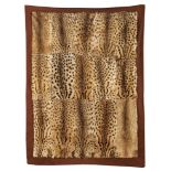 Taxidermy: A 15 skin Ocelot felt backed car rug, 1920’s, 185cm by 145cm