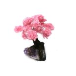 Interior Design/Minerals: A rose quartz tree with fifteen petals, on amethyst and composition base,