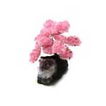 Interior Design/Minerals: A rose quartz tree with fifteen petals, on amethyst and composition base,