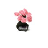 Interior Design/Minerals: A rose quartz tree with nine petals, on amethyst and composition base, 14c