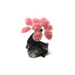 Interior Design/Minerals: A rose quartz tree with nine petals, on amethyst and composition base,