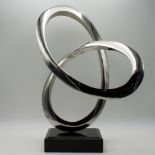 Sculpture: Infinity Curve, Stainless steel, 55cm high by 40cm wide by 32cm deep