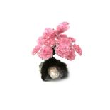 Interior Design/Minerals: A rose quartz tree with fifteen petals, on amethyst and composition base,