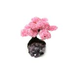 Interior Design/Minerals: A rose quartz tree with fifteen petals, on amethyst and composition base,