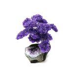 Interior Design/Minerals: An amethyst tree with fifteen petals on composition and amethyst base, 18c