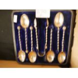 Set of silver spoons and tongs