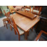 Oak extending dining table and chairs