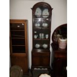 Queen Anne style display cabinet on pad feet