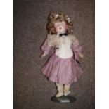 A porcelain 43cm doll marked S H 1909 ( fingers missing )