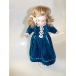 A porcelain doll marked AM 2/dep with articulated body ( finger missing )