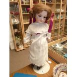 A 68cm A and M porcelain doll in good condition