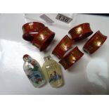 Oriental napkin rings and scent bottles
