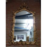 Large ornate gilt-framed mirror