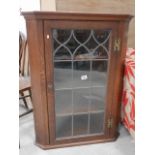 Oak glass front corner cupboard