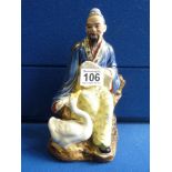 Oriental figure with stamp to base