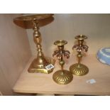 Pair of brass candlesticks and a raised pedestal plate