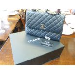 A Chanel top handle bag in Navy with burgundy handle and silver tone metal ( ex condition )
