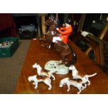 Beswick huntsman figure and four beagles