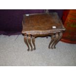 Nest of carved wood glass topped tables