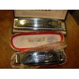 Pair of cased Hohner harmonicas