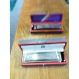 Pair of 'Super Chromonica' cased harmonicas