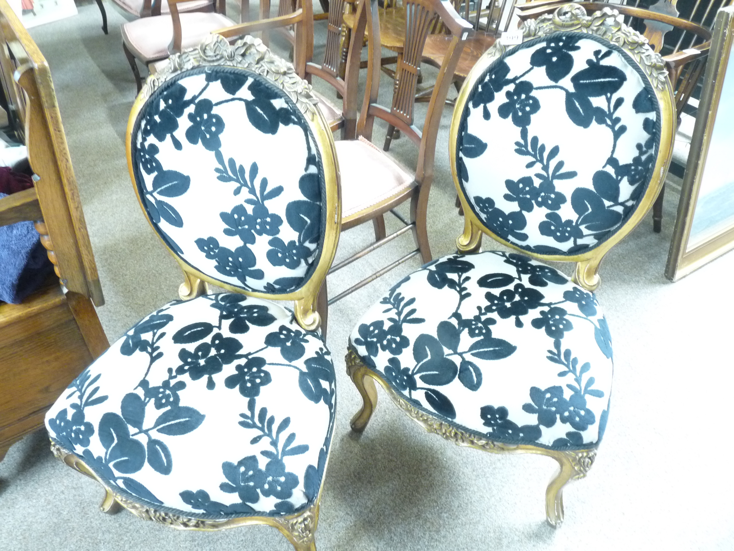 Pair of gilt carved chairs