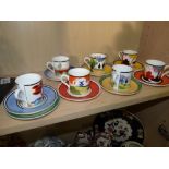 Collection of Clarice Cliff coffee cans and saucers