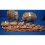 Pair of stone elephants and a wooden elephant ornament