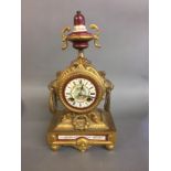 A 19TH CENTURY GILT METAL CLOCK The dial with Roman numeral chapter ring, foliate decoration and a