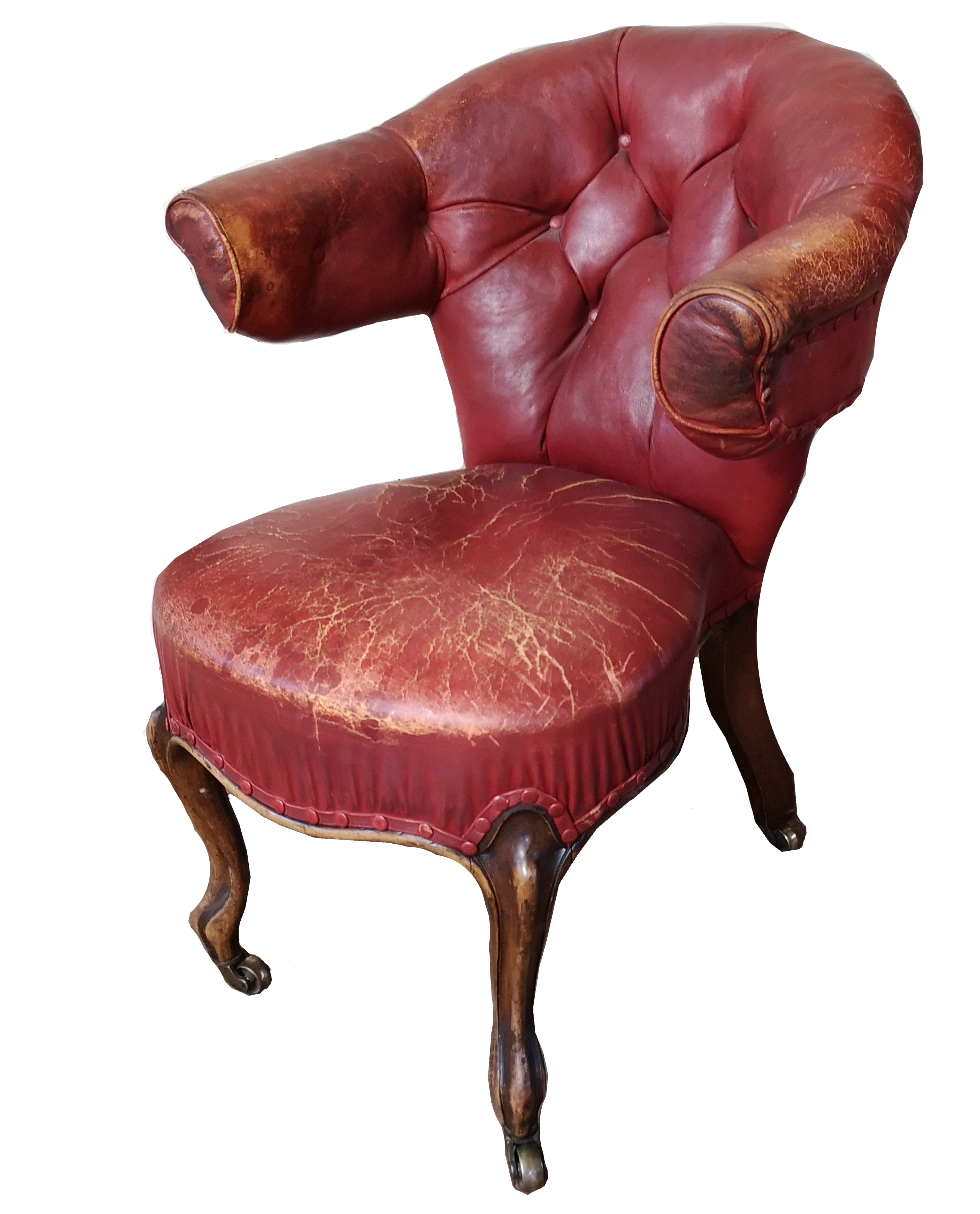 A 19TH CENTURY WALNUT AND RED LEATHER LIBRARY ARMCHAIR Button back upholstery, raised on carved