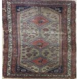 A MIDDLE EASTERN RUG Geometric design with three gulls, zoomorphic and floral decoration contained