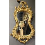 A LATE 19TH CENTURY MIRROR Gesso framed with gilt scroll decoration. (w 81cm x 109cm)