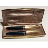 PARKER, 51, TWO GOLD FILLED FOUNTAIN PENS With blue and green body and engine turned decoration to