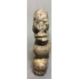 A SEIRRA LEONE CARVED STONE NOMOLI FIGURE In crouching pose with elongated features, bearing old