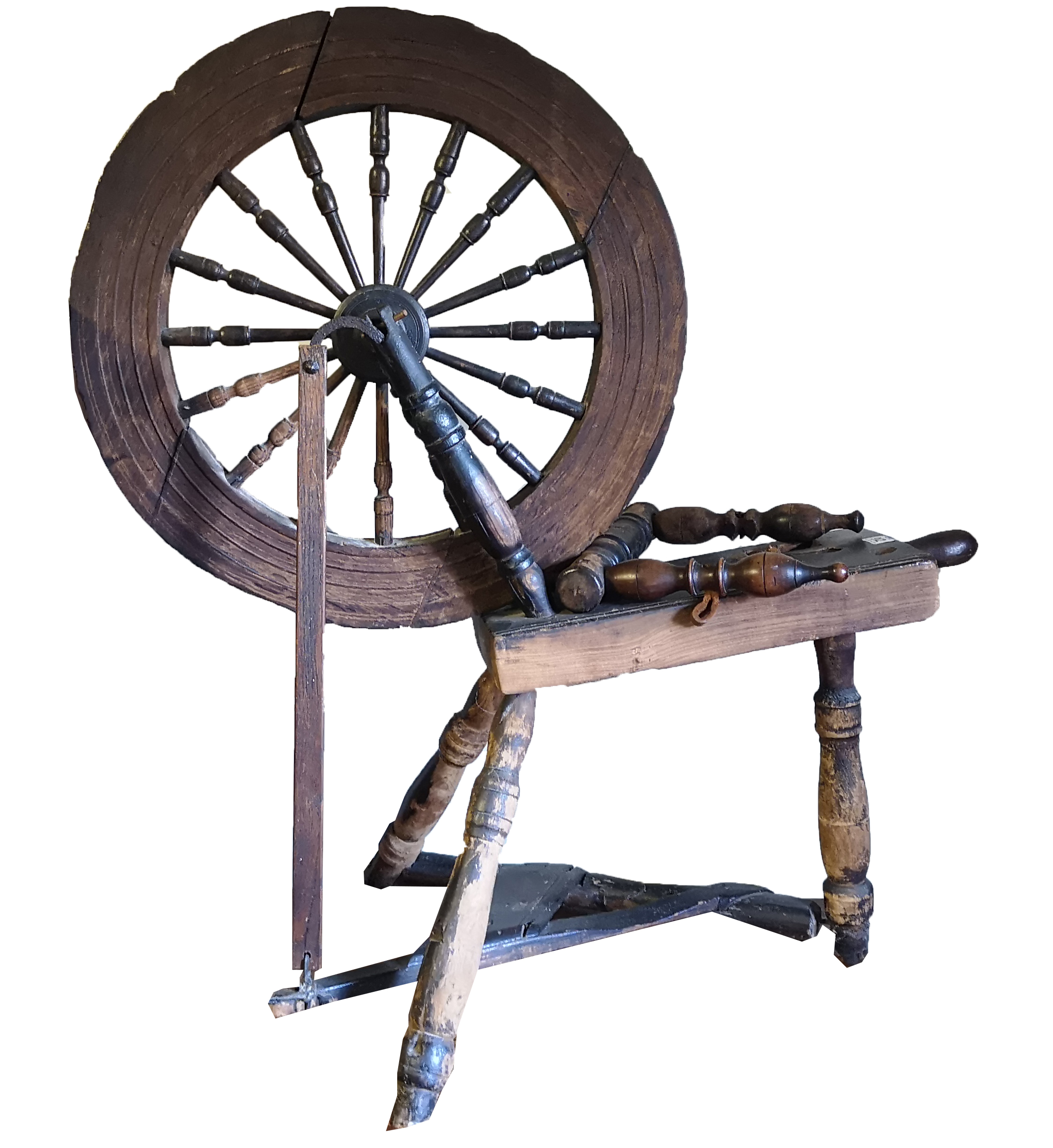 AN ANTIQUE OAK SPINNING WHEEL With turned spokes and hinged pedal.