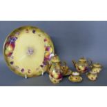 ROYAL WORCESTER, A MINIATURE PORCELAIN TEA AND COFFEE SET Comprising a circular tray/plate coffee