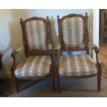 A PAIR OF 19TH CENTURY WALNUT OPEN ARMCHAIRS The framed finely carved with acanthus leaves and