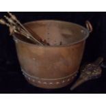 AN ARTS & CRAFTS COPPER LOG BASKET Twin handled with exposed rivet work, together with a set of