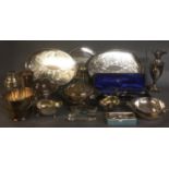 A SELECTION OF WHITE METAL ITEMS To include a pair of silver plated sauce boats, a silver plated