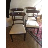 A SET OF FOUR EARLY 19TH CENTURY MAHOGANY BAR BACK DINING CHAIRS With carved rail over drop in