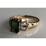 AN 18CT GOLD, SANTA ROSA TOURMALINE AND DIAMOND RING The emerald cut tourmaline flanked by diamond