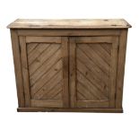 A VICTORIAN PINE CUPBOARD With two doors. (110cm x 86cm x 37cm)