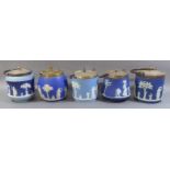 A COLLECTION OF FOUR 19TH CENTURY WEDGWOOD JASPERWARE BISCUIT BARRELS Having silver plated swing